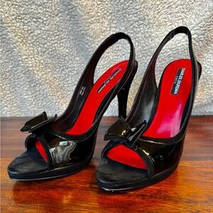 Charles Jourdan Paris black, patent leather stiletto heels. Size 9.